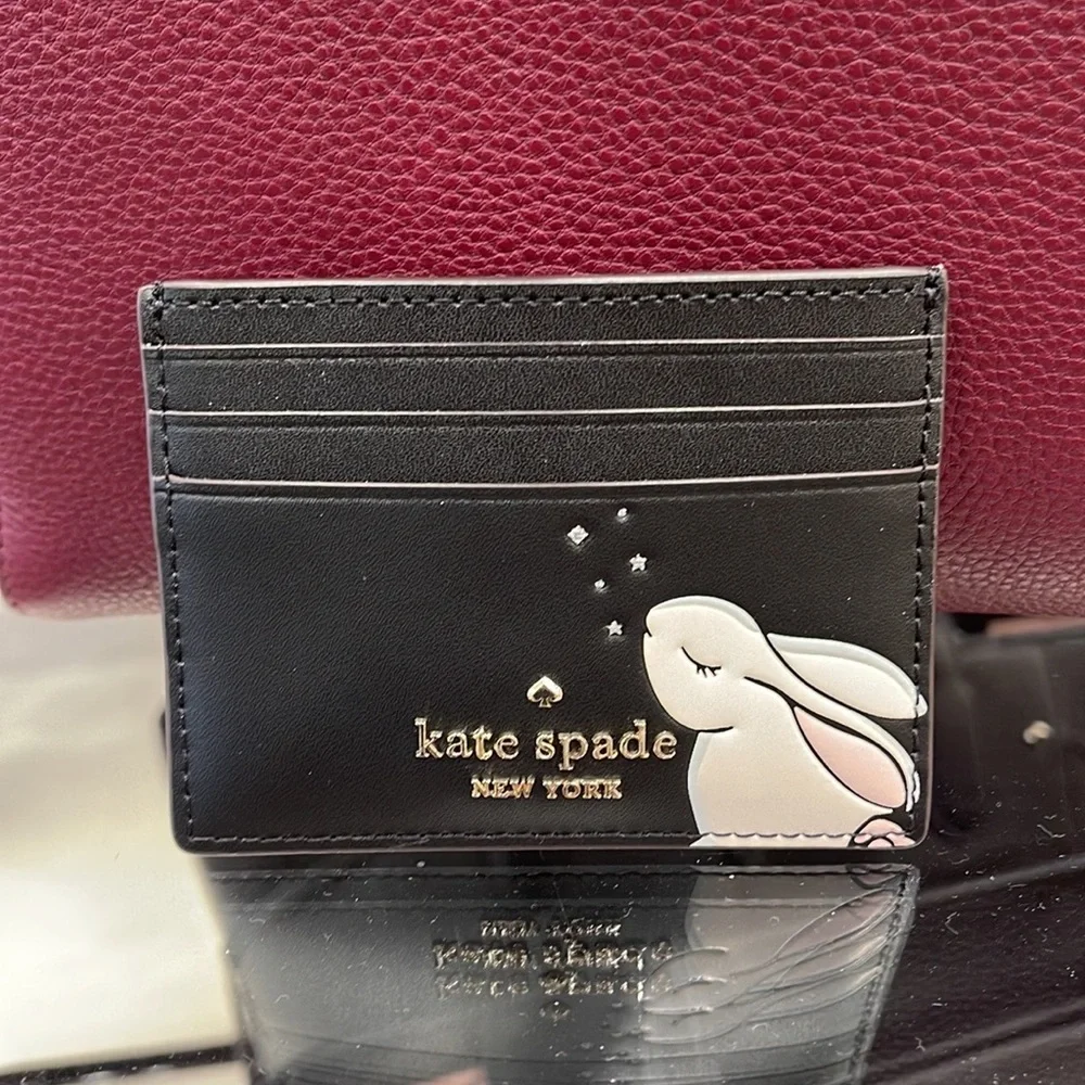 Kate Spade Bunbun Bunny Small Slim Card Holder Wallet

COLOR:
Black Multi
NWT - Picture 13 of 16